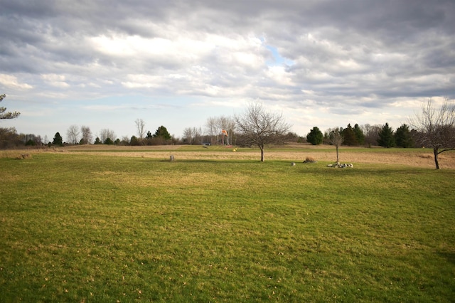 view of yard with a rural view