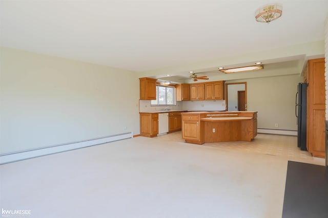 2428 Irma St, Warren, MI 48092 - kitchen with a center island, dishwasher, light countertops, a baseboard radiator, and freestanding refrigerator