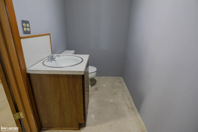 2428 Irma St, Warren, MI 48092 - bathroom featuring toilet, unfinished concrete floors, and vanity