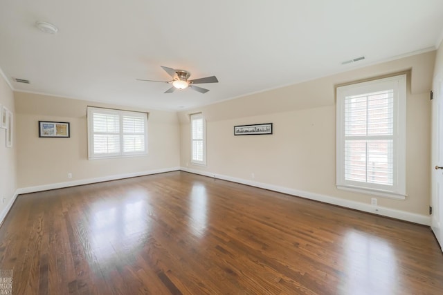 spare room with ceiling fan, visible vents, and ornamental molding