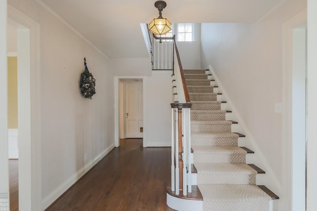 stairs with baseboards and wood finished floors