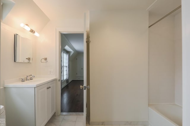 bathroom featuring vanity and baseboards