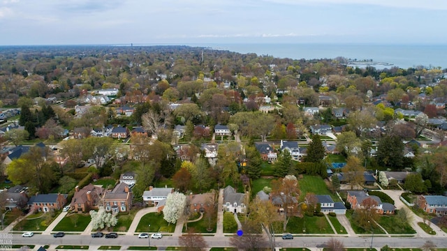 bird's eye view featuring a water view and a residential view