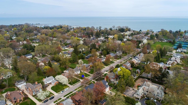 drone / aerial view featuring a water view and a residential view