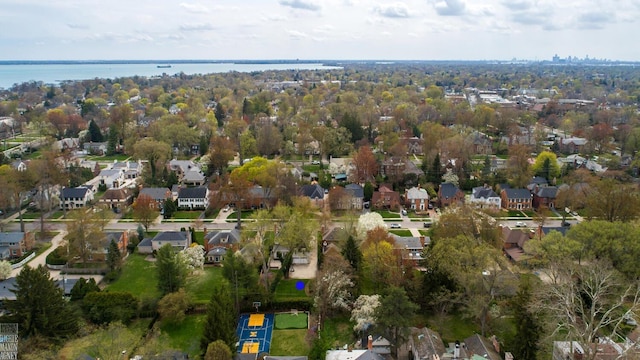 birds eye view of property featuring a water view and a residential view