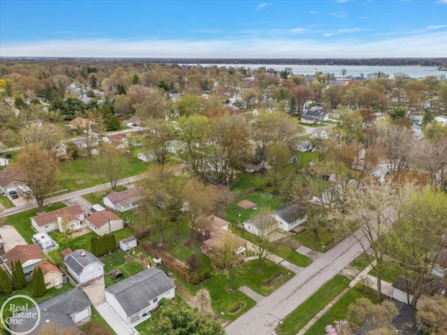 bird's eye view featuring a residential view and a water view