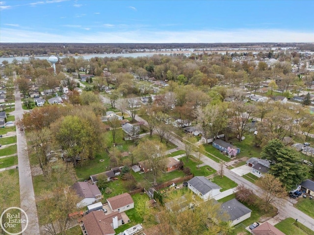 birds eye view of property with a water view and a residential view