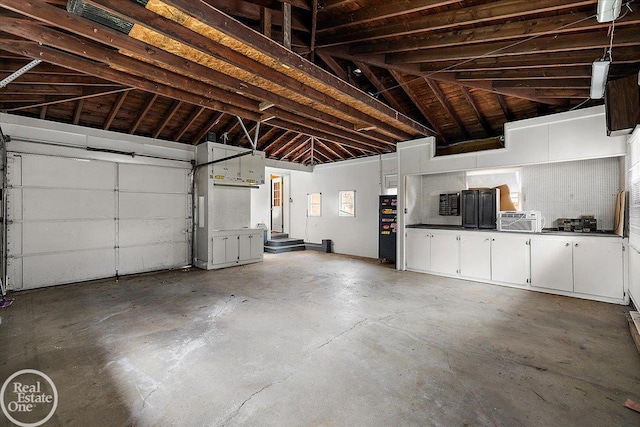 garage featuring freestanding refrigerator