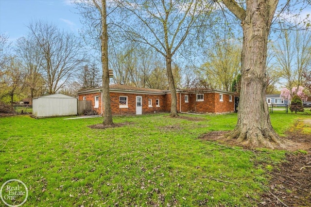 exterior space featuring brick siding, a front lawn, and fence