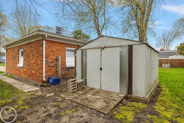 view of shed with fence