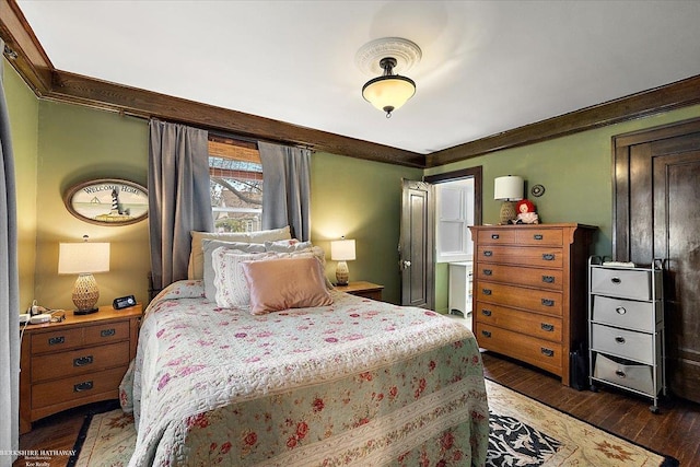 bedroom with dark wood-style floors
