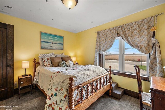 carpeted bedroom with baseboards