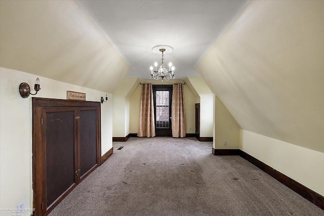 bonus room with carpet flooring, baseboards, an inviting chandelier, and lofted ceiling