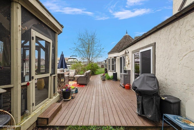 wooden terrace featuring area for grilling