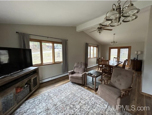 living area with baseboard heating, wood finished floors, lofted ceiling with beams, a baseboard heating unit, and ceiling fan with notable chandelier