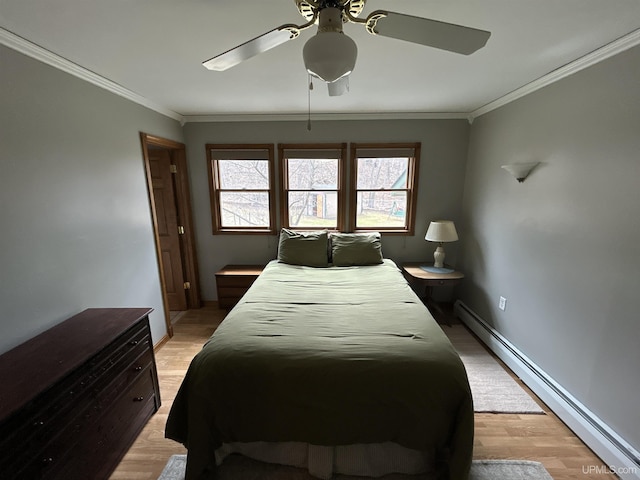 bedroom featuring ceiling fan, ornamental molding, light wood finished floors, and a baseboard radiator