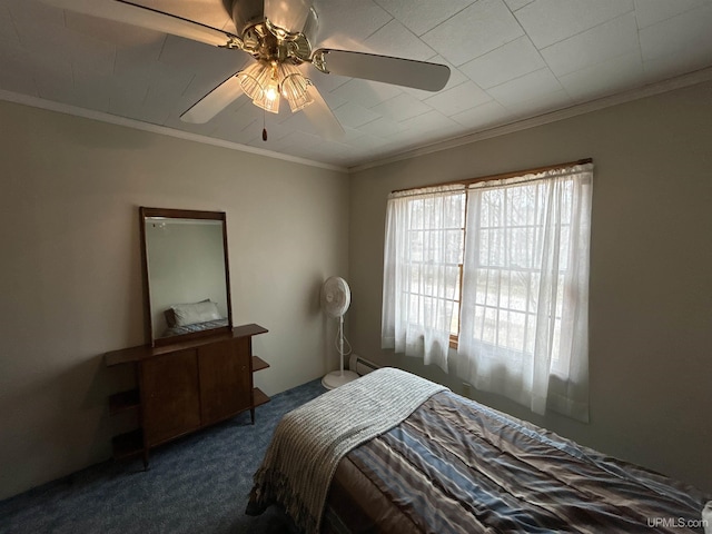 bedroom featuring ornamental molding, a ceiling fan, and dark carpet