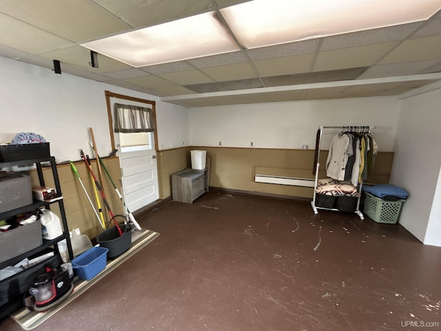 basement with a paneled ceiling
