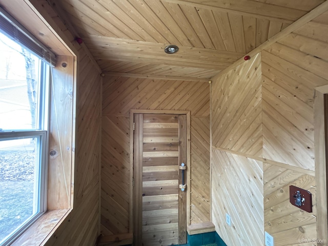 interior space with wooden walls and wood ceiling