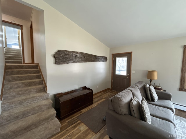living area featuring a baseboard radiator, wood finished floors, vaulted ceiling, and stairway