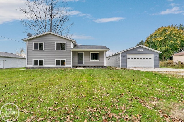 split level home featuring a detached garage, an outdoor structure, and a front lawn