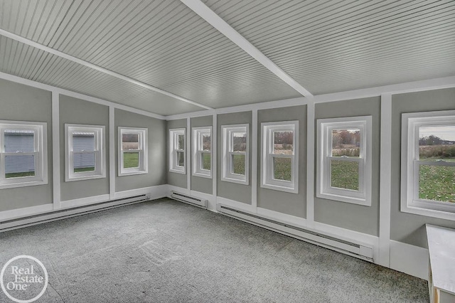 unfurnished sunroom with a baseboard heating unit