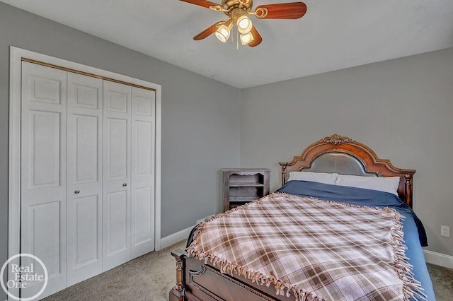 carpeted bedroom with baseboards, a ceiling fan, and a closet