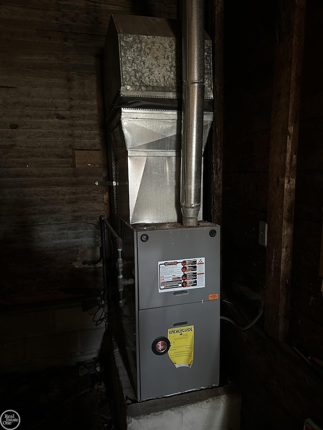 utility room with heating unit