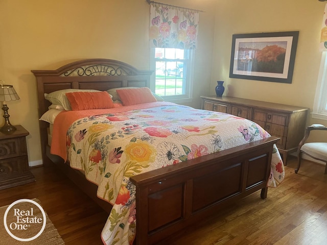 bedroom featuring wood finished floors