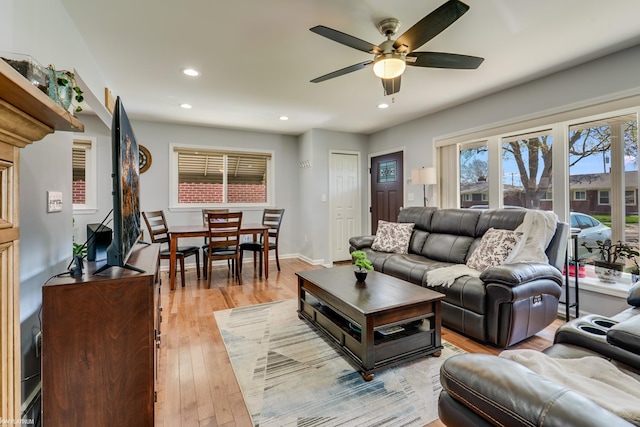 living area with ceiling fan, recessed lighting, and light wood-style flooring