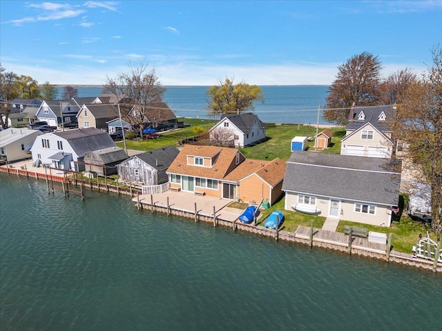 aerial view featuring a water view and a residential view
