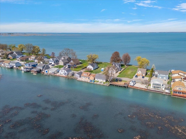 bird's eye view featuring a water view and a residential view