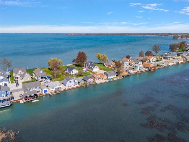 bird's eye view with a water view and a residential view