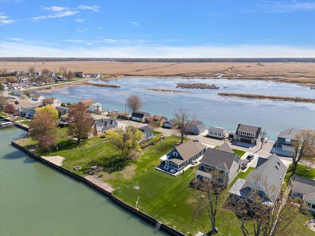 bird's eye view with a water view and a residential view