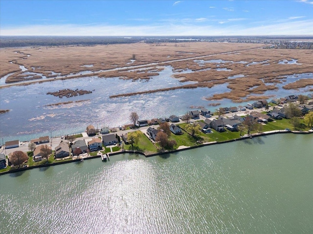 bird's eye view featuring a water view and a residential view