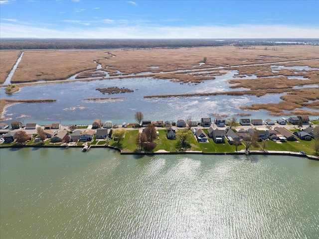 drone / aerial view featuring a residential view and a water view