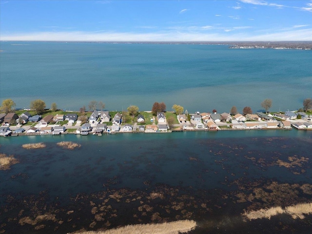 birds eye view of property featuring a water view and a residential view