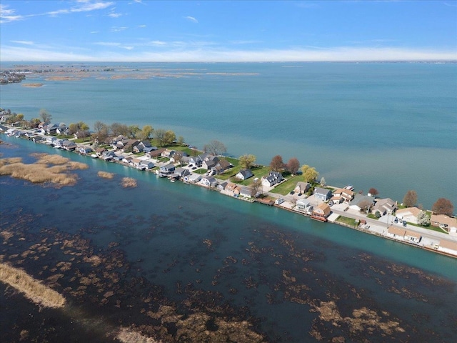birds eye view of property featuring a water view and a residential view