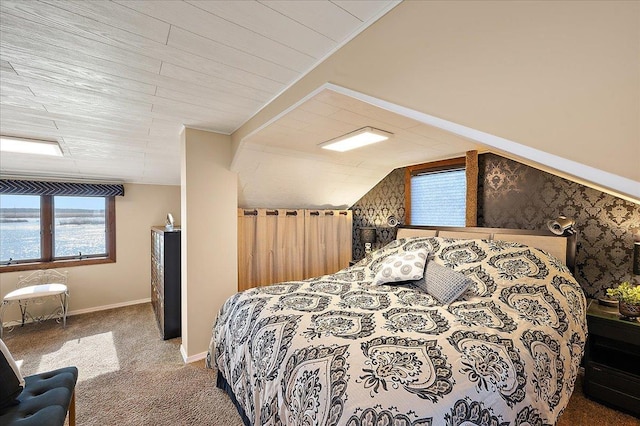 carpeted bedroom featuring multiple windows and vaulted ceiling