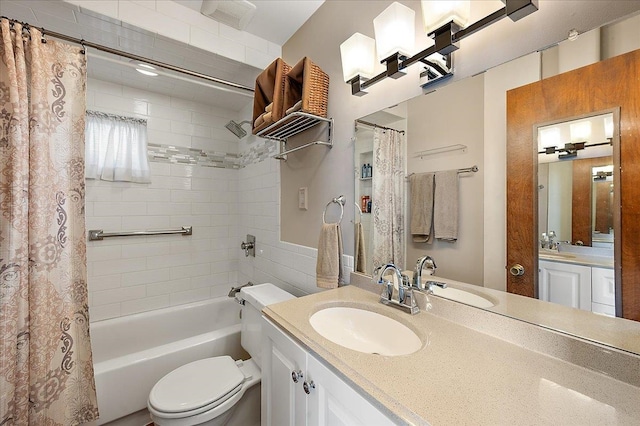 bathroom with shower / bath combo with shower curtain, toilet, and vanity
