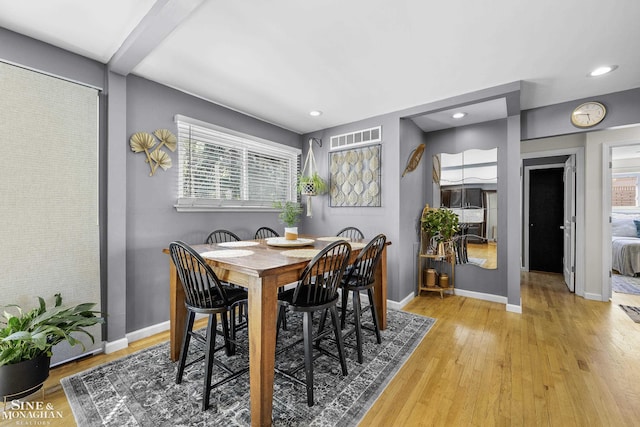 dining room with recessed lighting, baseboards, visible vents, and light wood-style flooring