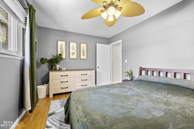 bedroom featuring a ceiling fan and light wood-type flooring