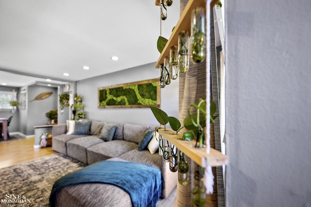 living area with recessed lighting, baseboards, and wood finished floors