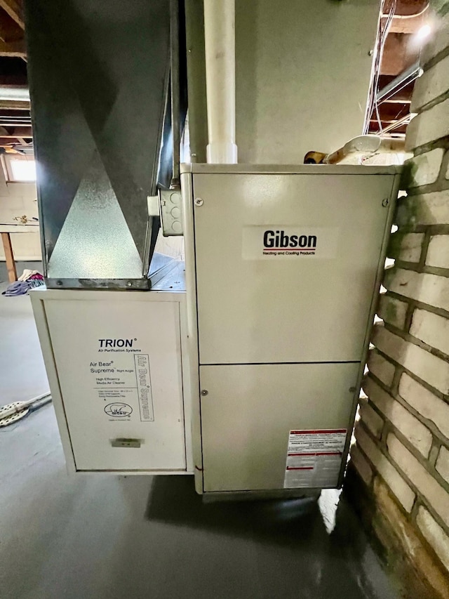 utility room with heating unit