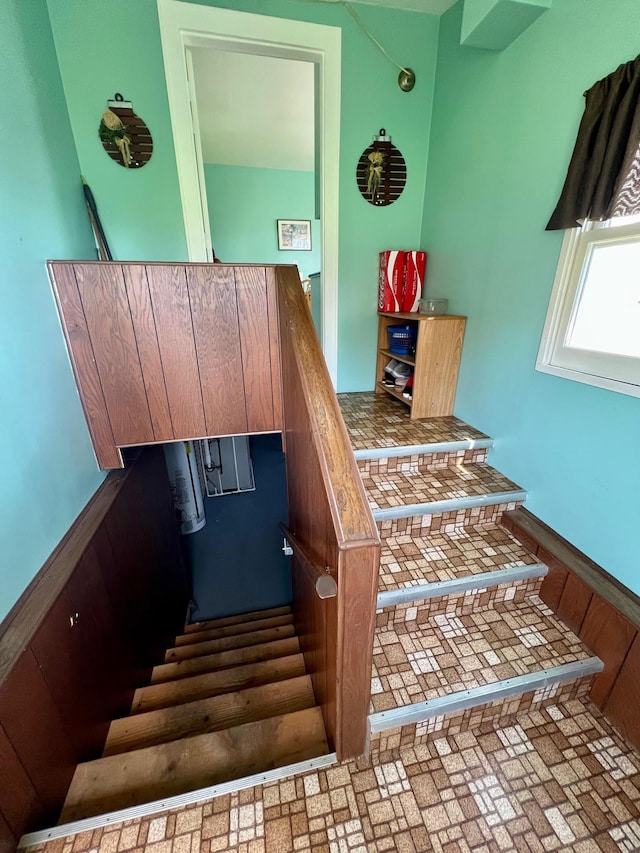 staircase featuring baseboards