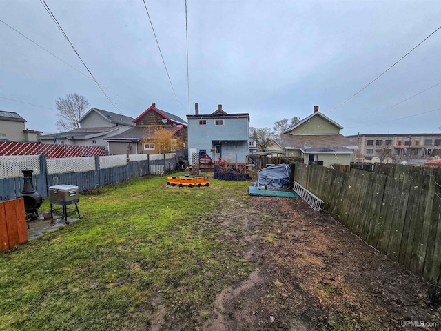 view of yard featuring a fenced backyard and a wooden deck