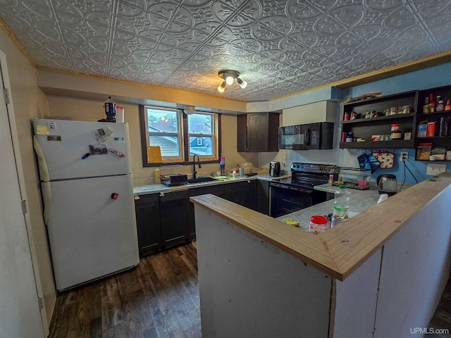kitchen featuring a sink, dark wood finished floors, an ornate ceiling, and black appliances