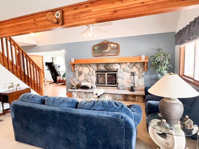5421 Andrew St, Harrison, MI 48625 - living area with stairs, ceiling fan, vaulted ceiling, and a stone fireplace