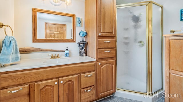 bathroom with vanity and a stall shower
