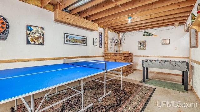 recreation room with concrete floors